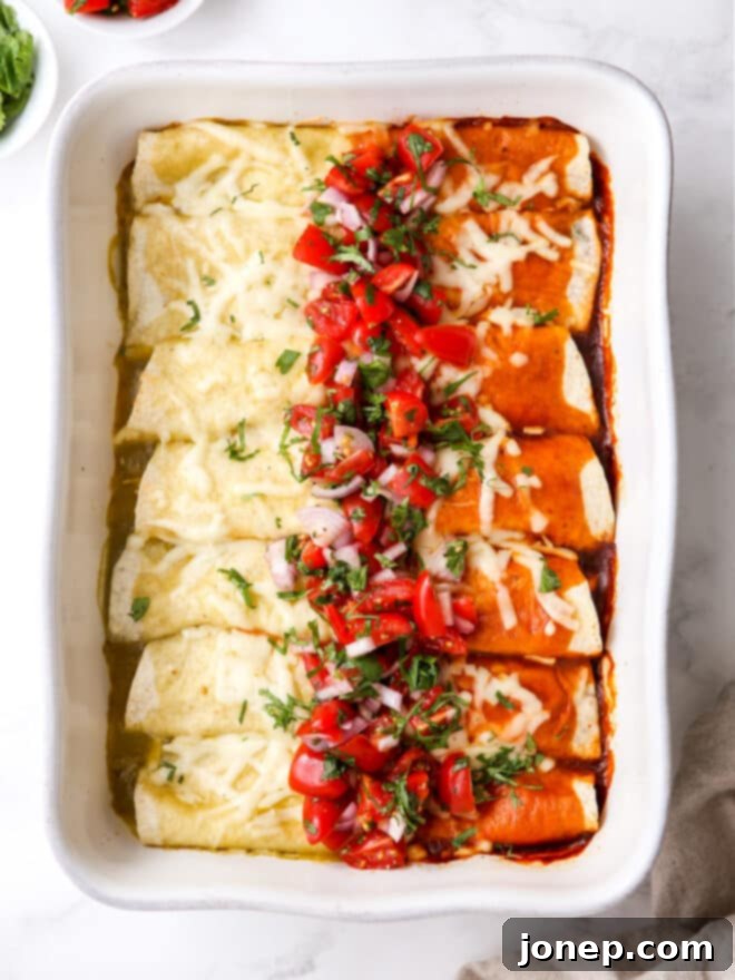 Vibrant Red and Green Chicken Enchiladas 2 Two red and green enchiladas on a plate with salsa and a lime wedge