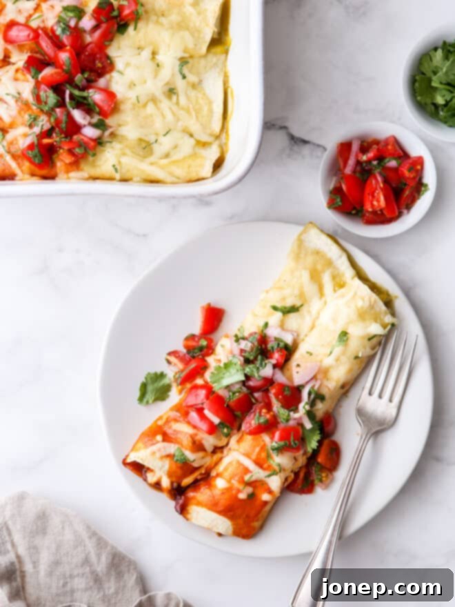 Vibrant Red and Green Chicken Enchiladas 3 red and green enchiladas on a plate