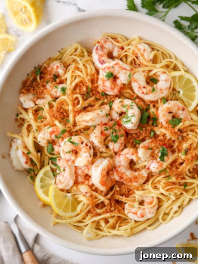 Zesty Shrimp Scampi Pasta 2 Closeup of vibrant shrimp scampi pasta with fresh parsley in a large bowl, ready to be served.