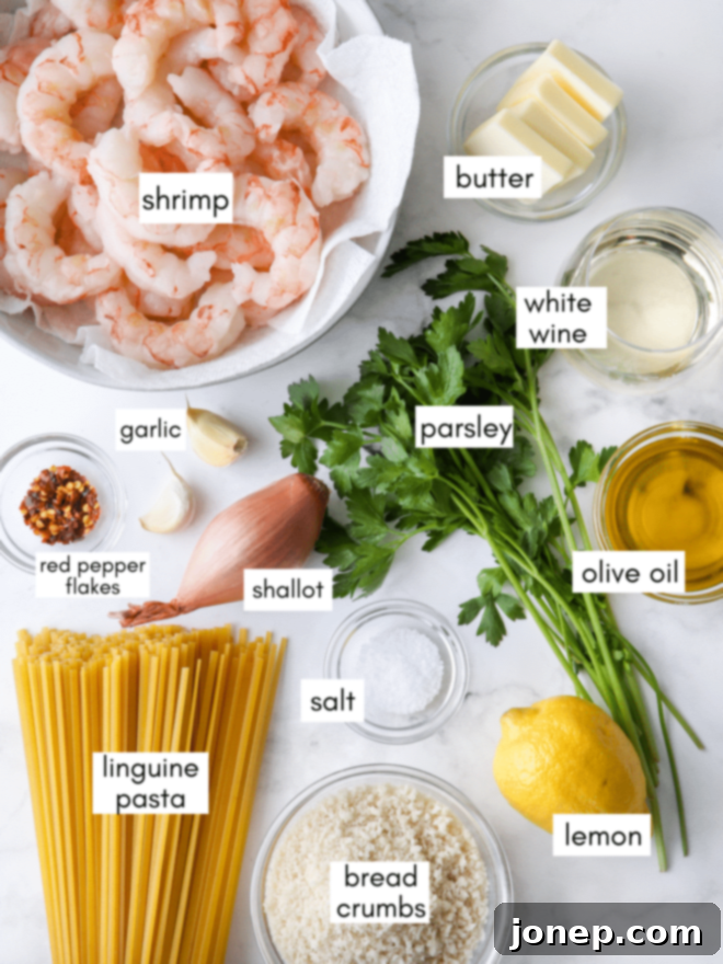 Zesty Shrimp Scampi Pasta 3 All the fresh ingredients for making shrimp scampi pasta laid out with labels.
