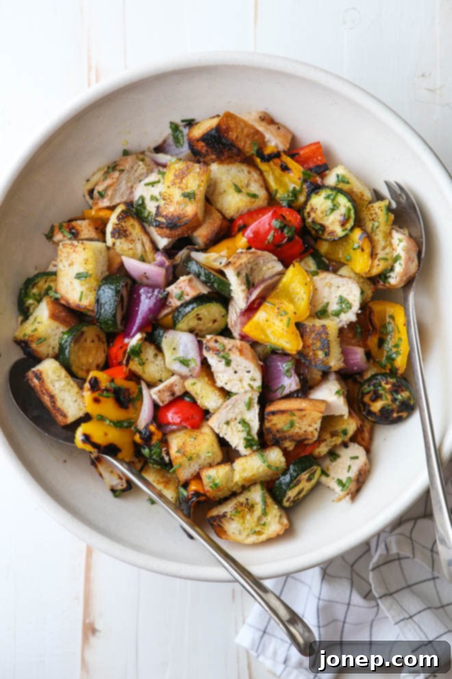 Delicious grilled chicken and vegetable panzanella salad, a perfect summer meal