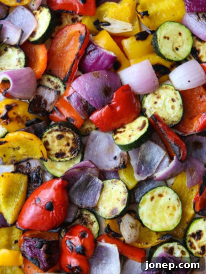 Overhead view of grilled chicken and vegetable panzanella salad ingredients