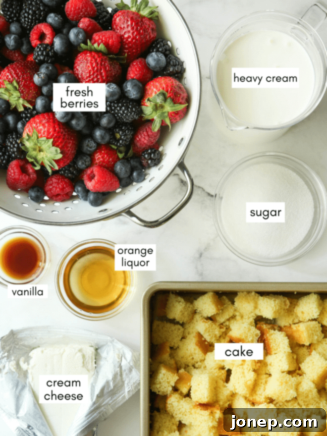 Layers of Summer Berry Bliss 3 A selection of fresh berries, cream cheese, heavy cream, sugar, and vanilla extract laid out as ingredients for berry trifle.