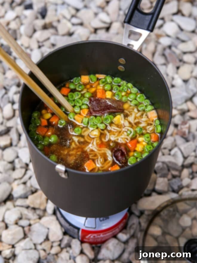 Backpacking Ramen Hacks 2 closeup of backpacking ramen in pot over stove