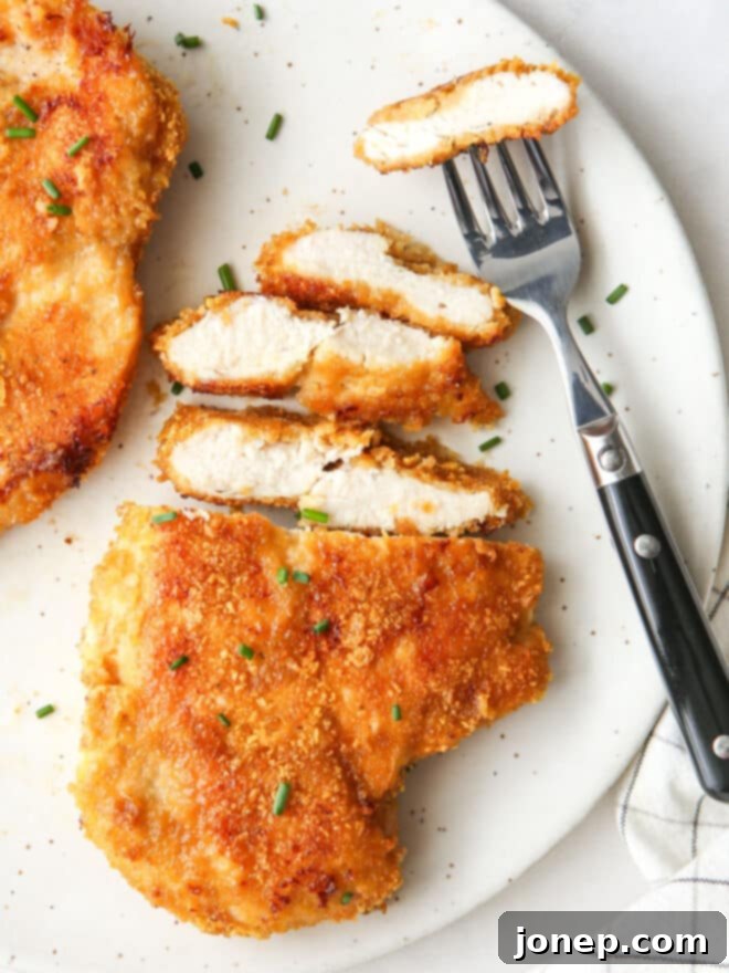 Crispy Baked Chicken 3 sliced oven fried chicken with fork