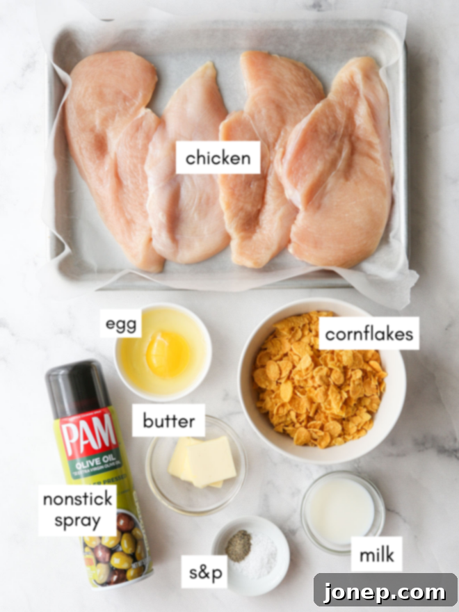 Crispy Baked Chicken 4 Selection of ingredients for oven fried chicken: chicken breasts, cornflakes, egg, milk, butter, salt, pepper