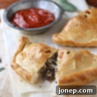 Tuscan Sausage, Mushroom & Olive Calzones 2 Calzones with Sausage, Mushrooms and Olives from completelydelicious.com