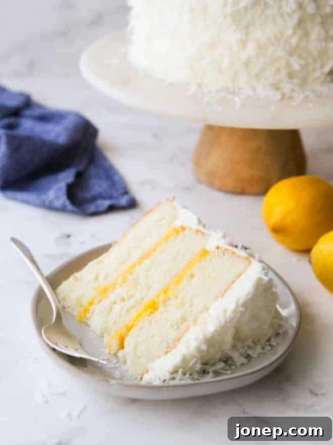 Luscious Lemon Coconut Cake 11 a perfect slice of lemon coconut cake on a white plate