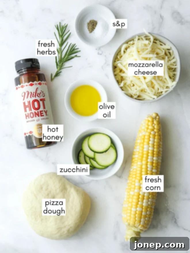 Sweet Corn and Zucchini Pizza 4 Zucchini corn pizza ingredients laid out with labels, showing corn, zucchini, cheese, and herbs