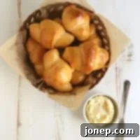 Perfectly baked Sweet Potato Crescent Rolls with honey butter