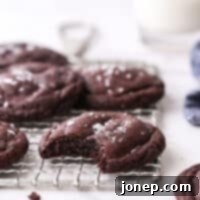 Ultimate Soft and Chewy Chocolate Cookies 7 bite taken out of chocolate cookie
