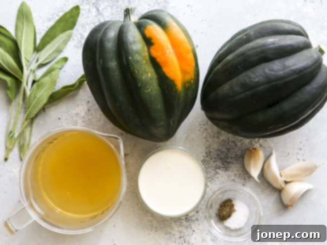 Golden Roasted Acorn Squash with Velvety Sage Cream 3 A selection of fresh ingredients including acorn squash, fresh sage, garlic cloves, and chicken broth, prepared for the sage cream sauce.