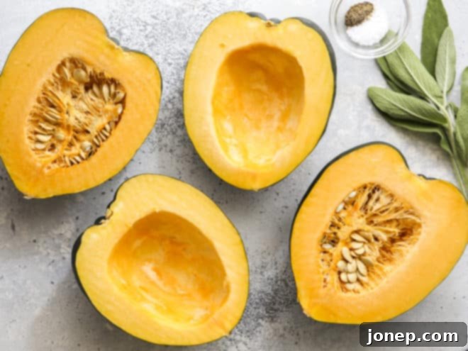 Golden Roasted Acorn Squash with Velvety Sage Cream 4 Close-up of a chef carefully slicing an acorn squash in half, revealing its vibrant orange flesh and seed cavity, ready for preparation.