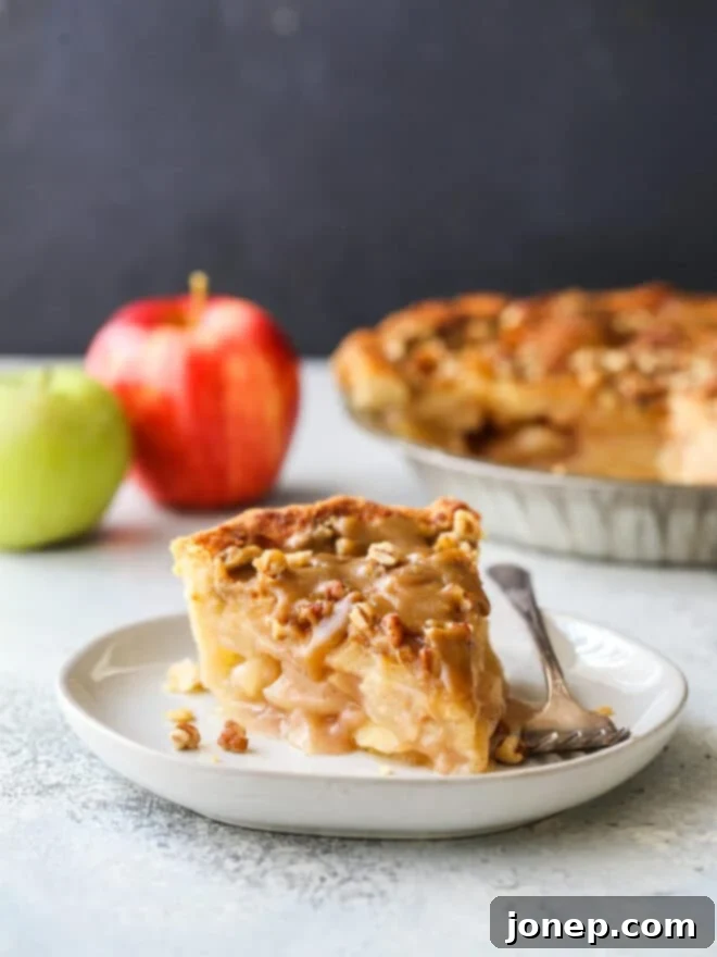 slice of apple pear praline pie on a plate