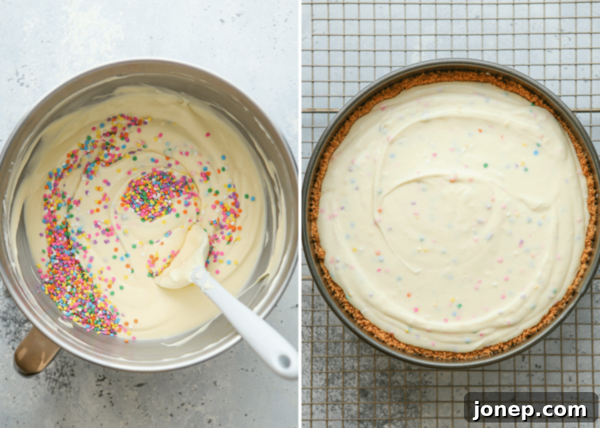 funfetti cheesecake filling poured into crust ready for water bath