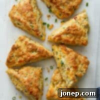 Classic Savory Scones 8 Beautifully baked savory scones on a plate, ready to be served.