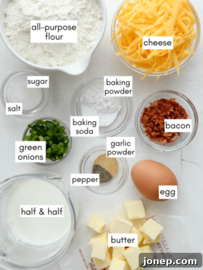 Classic Savory Scones 4 Measured ingredients for savory scones laid out on a counter, including flour, butter, cheese, and scallions