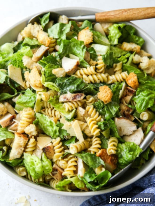 close up of chicken caesar pasta salad in a bowl