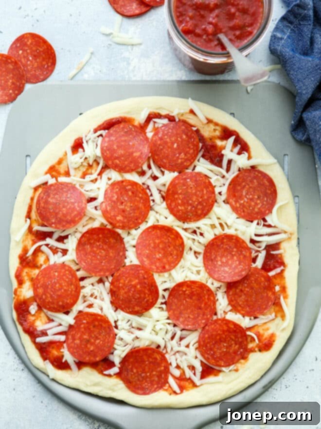 assembled pizza ready to bake