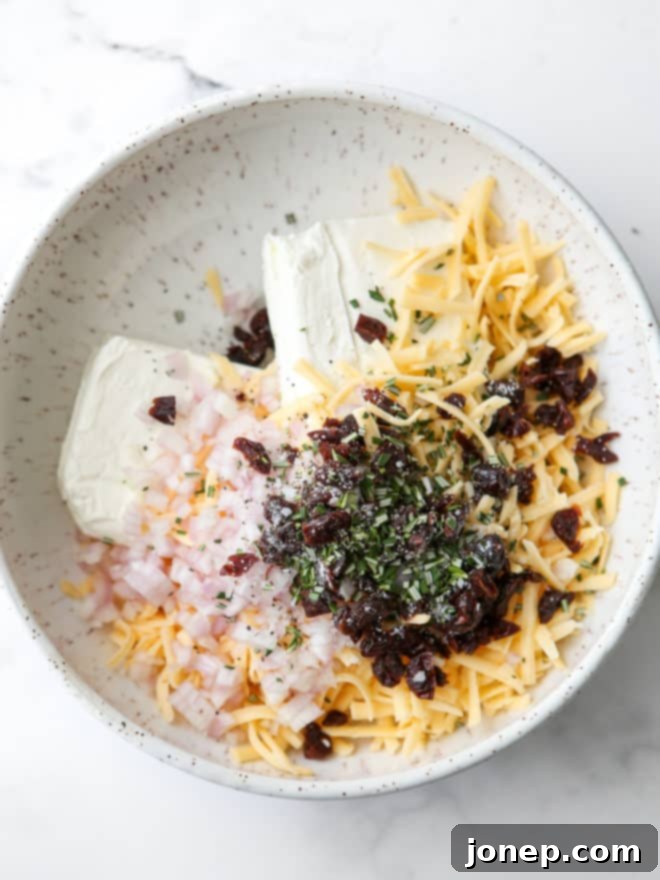 all of the cheeseball ingredients in a bowl