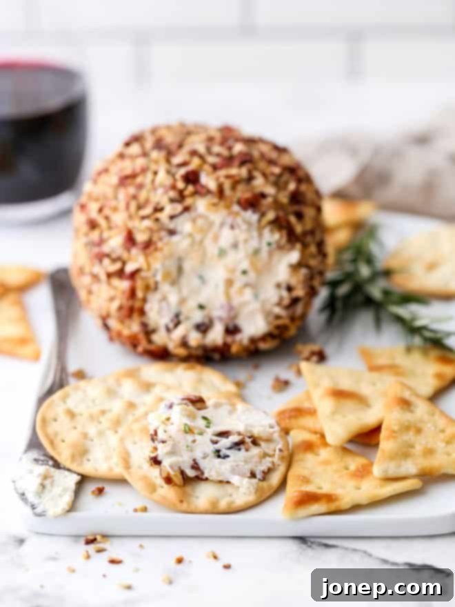 a spread of cheeseball on a cracker