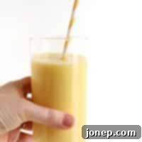 Tropical Mango Colada Bliss 2 A close-up of Mango Pina Colada Smoothie with ingredients