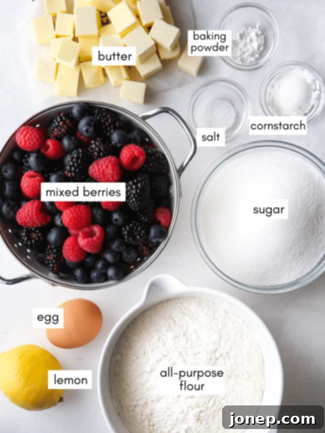 close-up of ingredients for berry crumb bars including flour, sugar, butter, and mixed berries