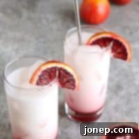 Sparkling Blood Orange Delight 2 Blood Orange Italian Sodas | completelydelicious.com - A top-down view of a glass of blood orange Italian soda.