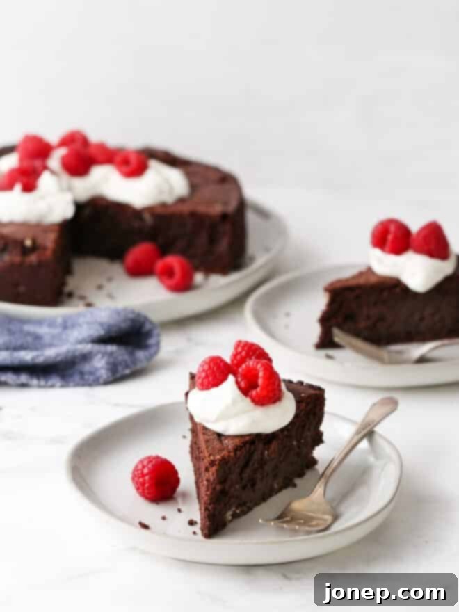 Gluten-Free Chocolate Almond Torte 2 sliced flourless chocolate almond cake on plates