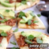 BBQ Pulled Pork Avocado Flatbread Pizzas 3 BBQ Pulled Pork and Avocado Flatbread Pizzas | completelydelicious.com