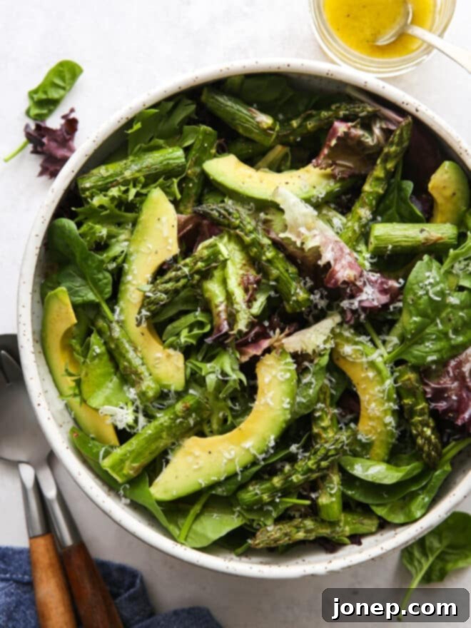 Roasted Asparagus and Creamy Avocado Medley 2 Vibrant roasted asparagus avocado salad in a large, inviting bowl, garnished and ready to be served
