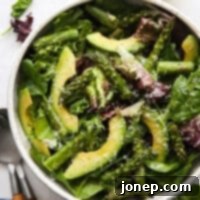 Roasted Asparagus and Creamy Avocado Medley 8 Roasted asparagus and avocado salad in a beautifully plated bowl, garnished and ready to be enjoyed