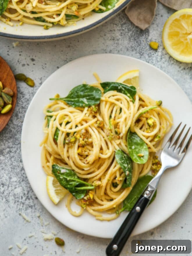 lemon pistachio pasta on a plate with fork