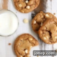 Toffee White Chocolate Macadamia Nut Cookies, showcasing their golden-brown perfection and tempting texture.