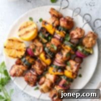 grilled lemon-cilantro veggie skewers on a plate
