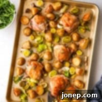 Sheet Pan Roasted Chicken with Potatoes and Leeks 8 one-pan roasted chicken and potatoes with bowl of arugula and yogurt dill sauce