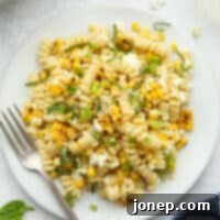Smoky Creamy Grilled Corn Pasta 8 Closeup of a single serving of creamy grilled corn pasta, perfectly plated and ready to eat