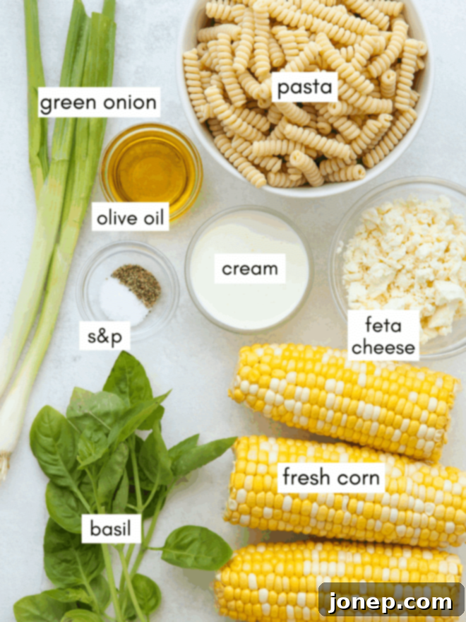 Smoky Creamy Grilled Corn Pasta 4 All essential ingredients for creamy grilled corn pasta, meticulously measured and laid out on a wooden cutting board with labels