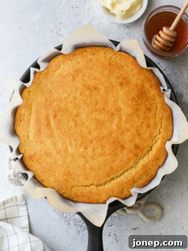 Honey-Kissed Buttermilk Cornbread 6 Baked honey buttermilk cornbread in a cast iron skillet, golden brown and ready to serve