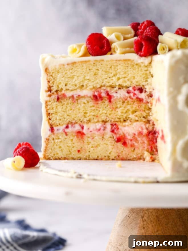 raspberry white chocolate cake sliced into