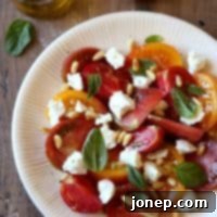 Vibrant Tomato Chèvre and Pine Nut Salad 2 Tomato Salad with Goat Cheese and Pine Nuts | completelydelicious.com