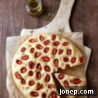 Roasted Tomato Focaccia Bread with fresh thyme | completelydelicious.com