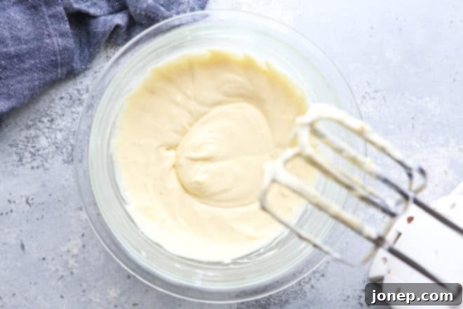 Creamy Danish Delights 4 mixing cream cheese filling with mixer