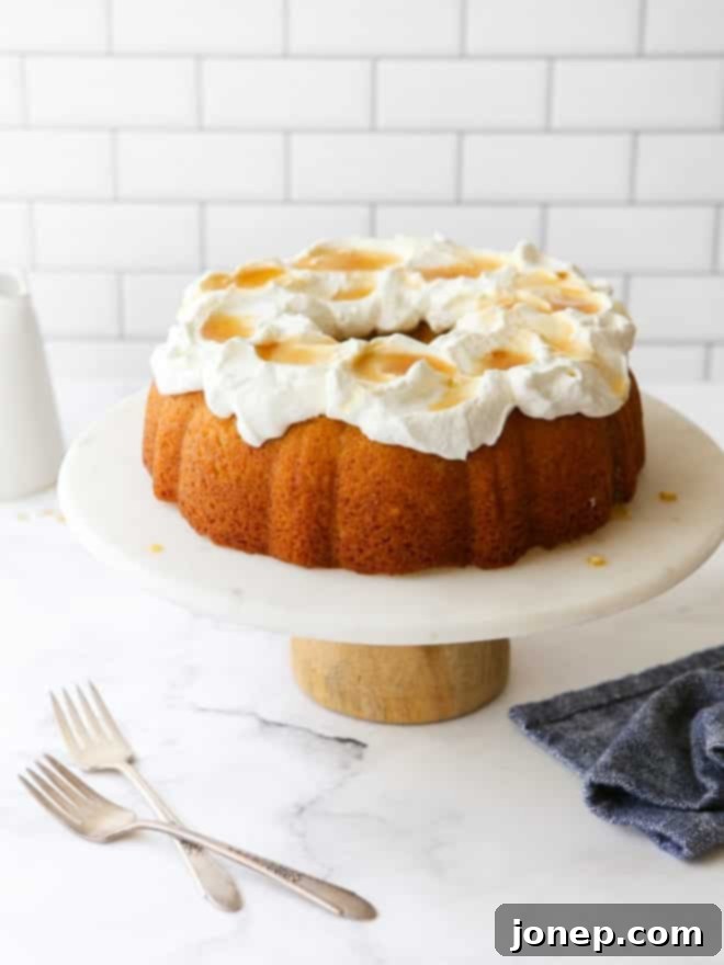 maple bundt cake on a cake stand with forks on the table