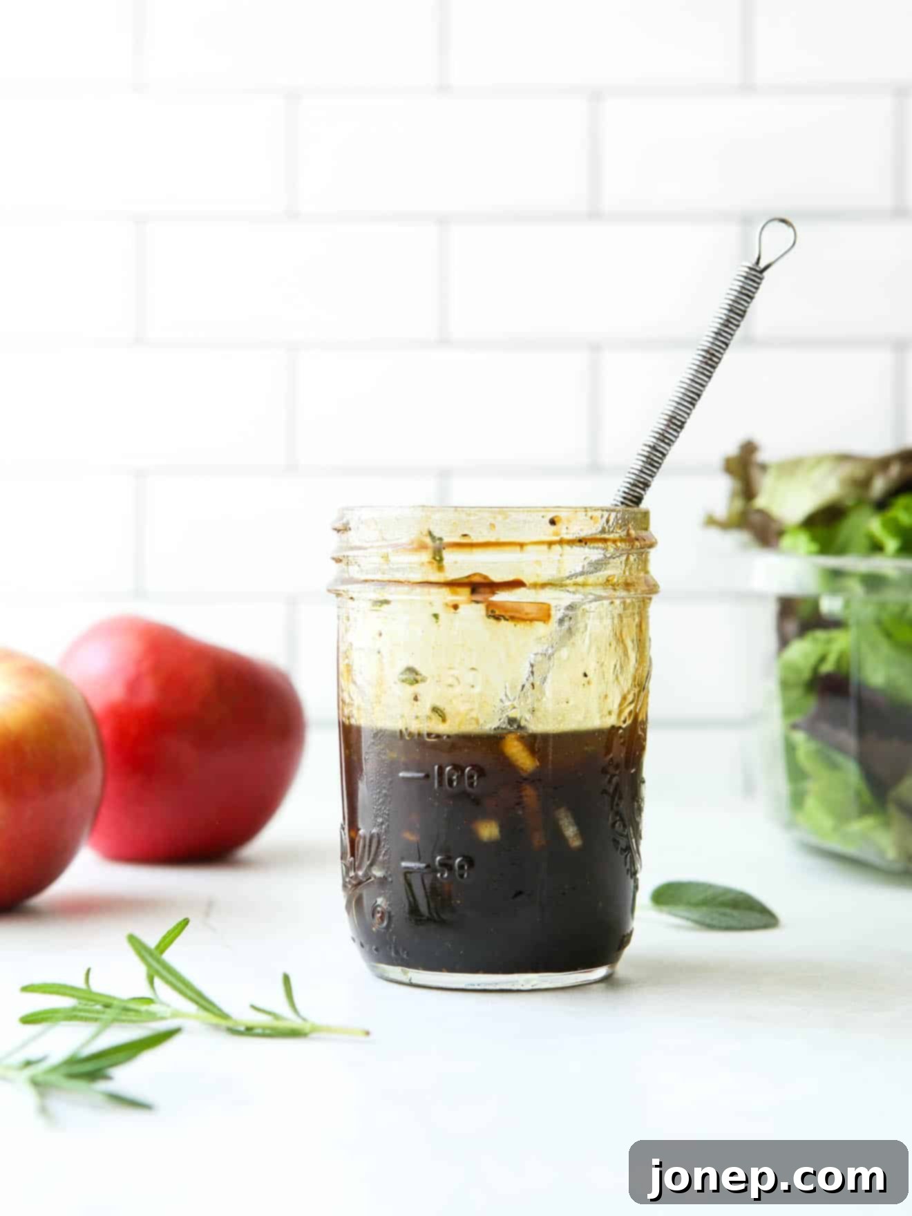 maple balsamic vinaigrette in a jar with whisk