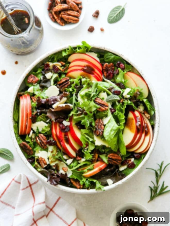 Harvest Apple Salad with Sharp Cheddar and Candied Pecans 7 mixed fall apple salad with jar of dressing on side