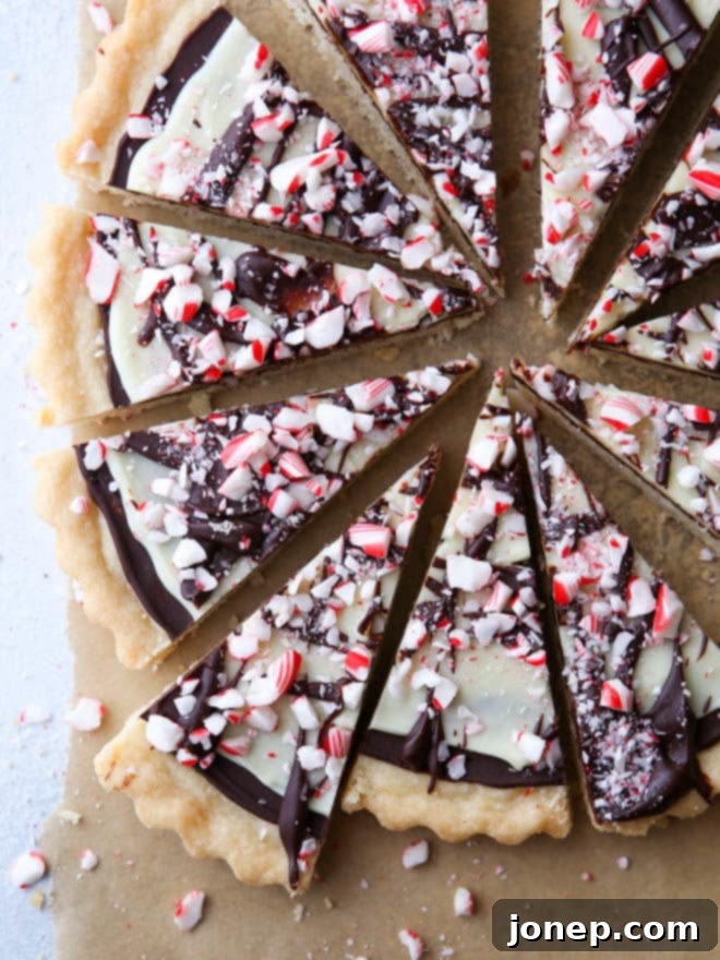 Close-up of a platter of freshly baked Peppermint Bark Shortbread Cookies ready for serving, highlighting the detailed topping.