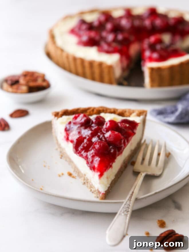 Velvety Cranberry Mascarpone Tart with Golden Pecan Crust 9 slice of cranberry mascarpone tart on plate