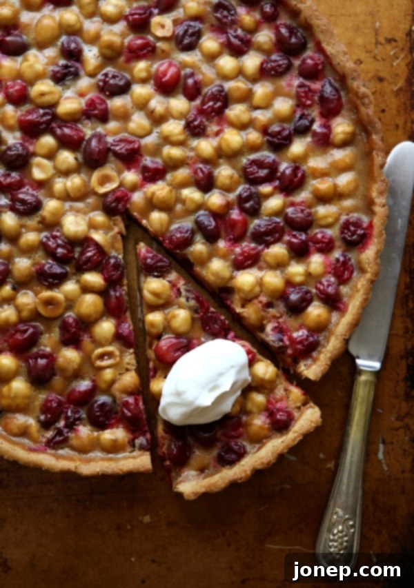 Velvety Cranberry Mascarpone Tart with Golden Pecan Crust 10 Cranberry, Caramel and Hazelnut Tart | completelydelicious.com
