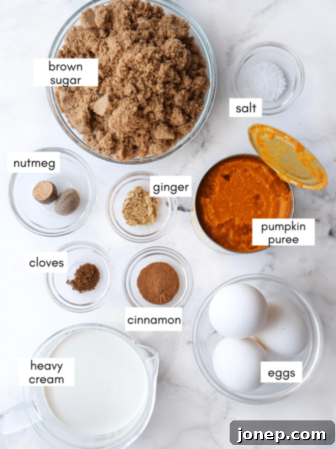 A collection of classic pumpkin pie ingredients, including pumpkin puree, eggs, spices, and heavy cream, arranged beautifully.